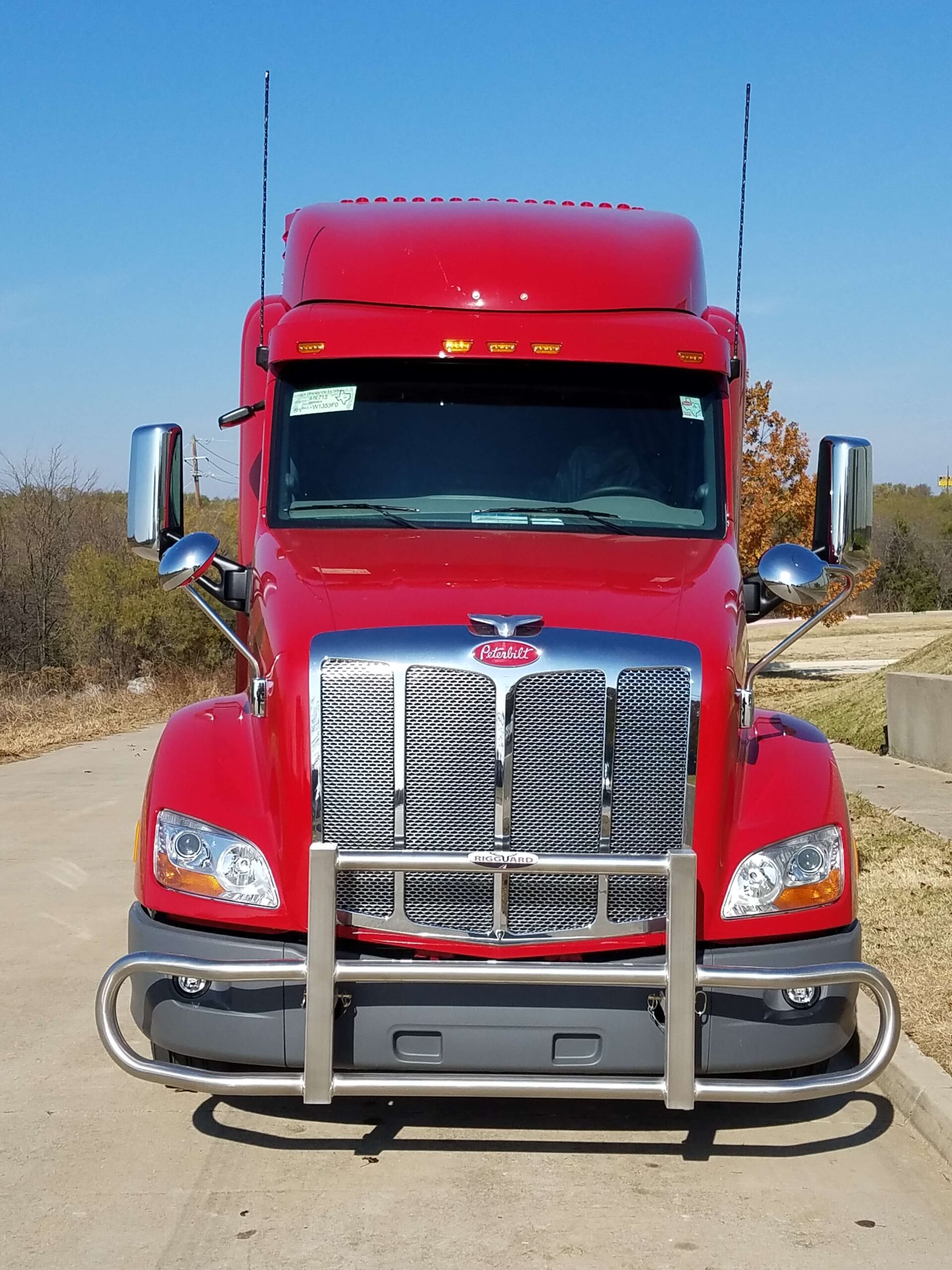 a red truck parked on a road