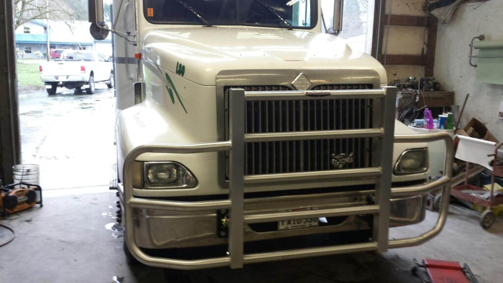 a white truck with a metal grill