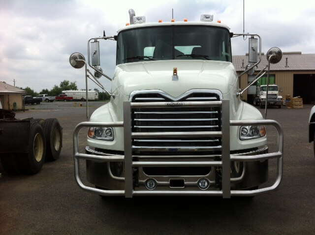 a white truck with a grill