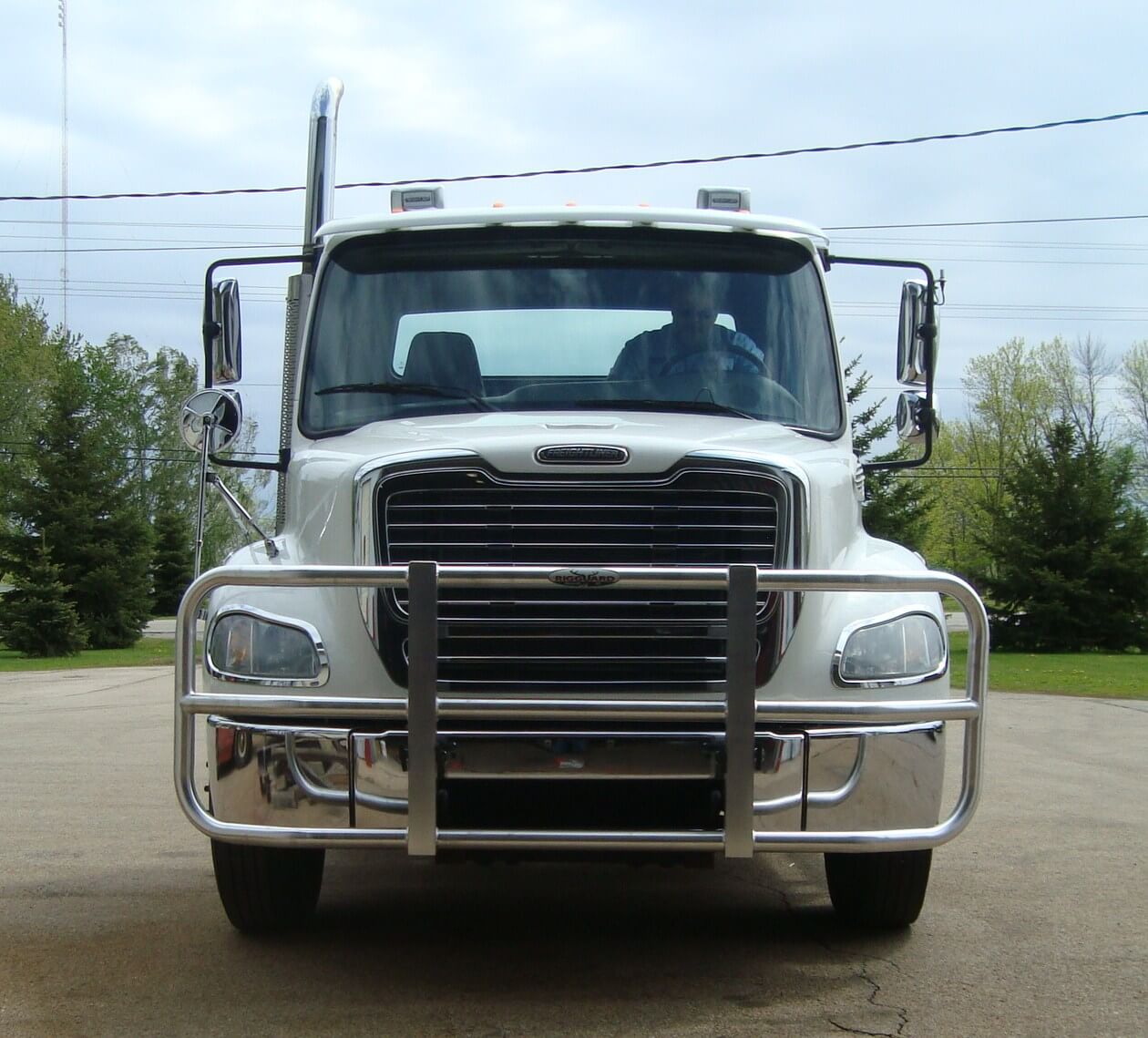 a white truck parked on a road