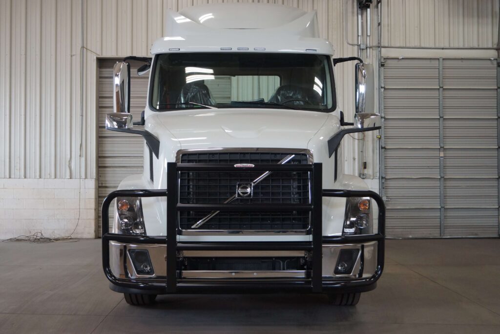 a white truck with a guard on the front